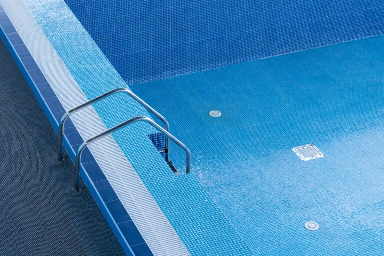 Large blue pool without water. Empty pool.